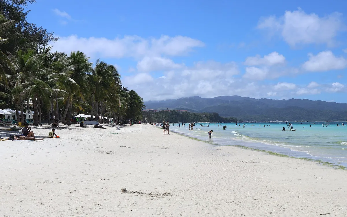White Beach at Station 2, Boracay, with wide white sand, coconut palms and turquoise water